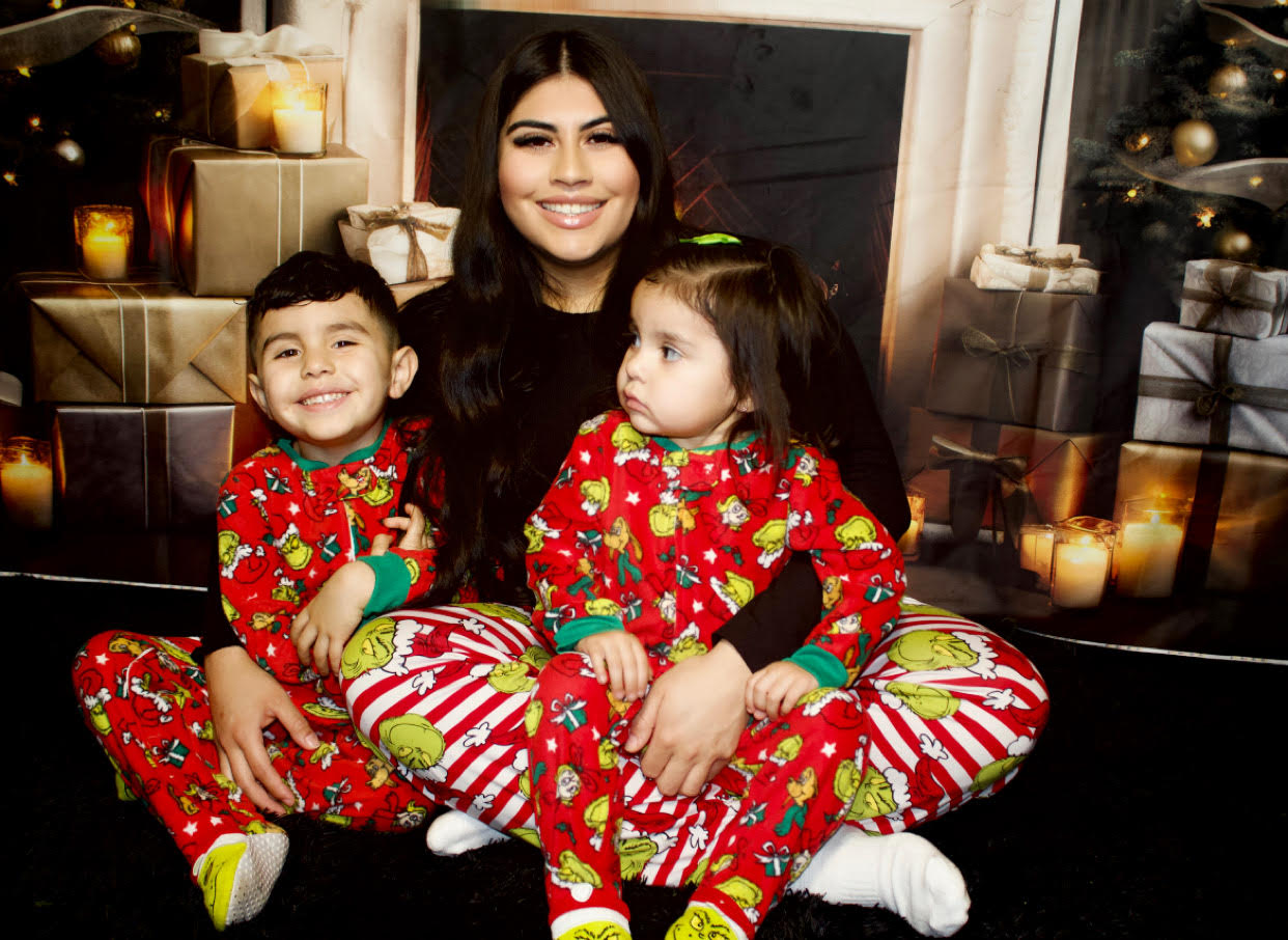 Jessica with her two children in matching holiday pajamas